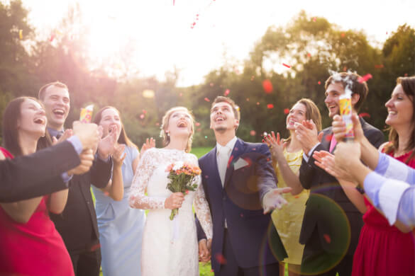 a wedding party throwing confetti 