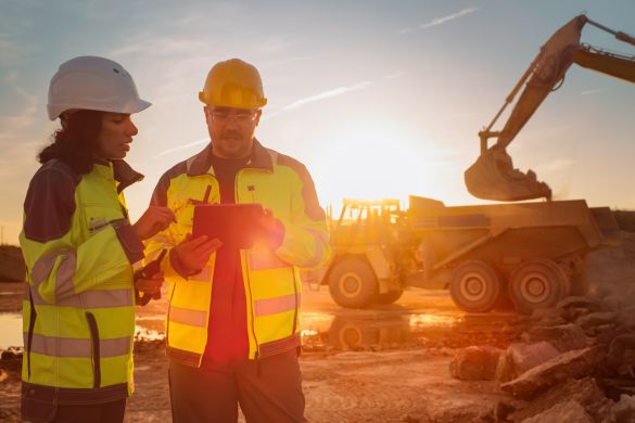 Construction workers discussing project at worksite